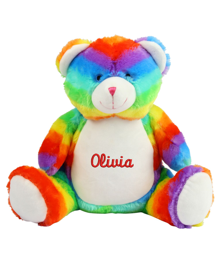 Multi-coloured soft plush bear. Contrast sewn nose and eyes. Cream coloured panel on tummy and feet. Complies with EN71 European Toy Safety regulations. Remove all hang tags and their fasteners before giving these items to a child. Suitable for all ages.