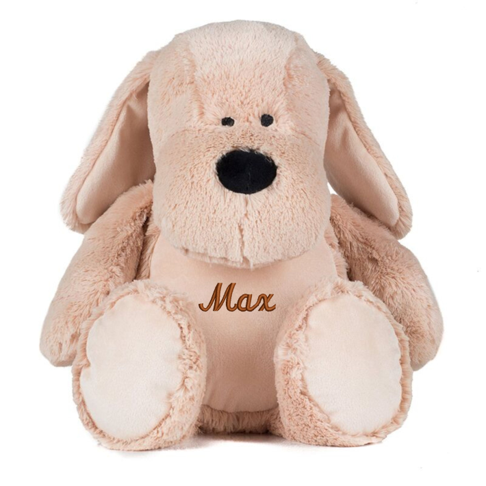 Mid Brown coloured soft plush dog. Floppy ears. Sewn eyes. Contrast brown nose. Light Brown coloured panel on chest and feet. Complies with EN71 European Toy Safety regulations. Remove all hang tags and their fasteners before giving these items to a child. Suitable for all ages.