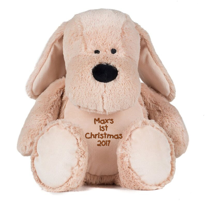 Mid Brown coloured soft plush dog. Floppy ears. Sewn eyes. Contrast brown nose. Light Brown coloured panel on chest and feet. Complies with EN71 European Toy Safety regulations. Remove all hang tags and their fasteners before giving these items to a child. Suitable for all ages.